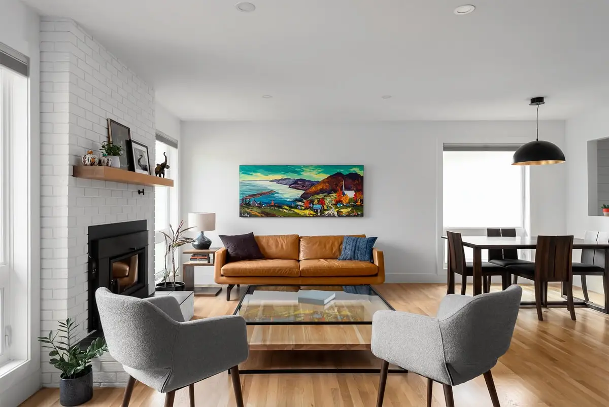 Bright, stylish living space with contemporary decor and large windows.