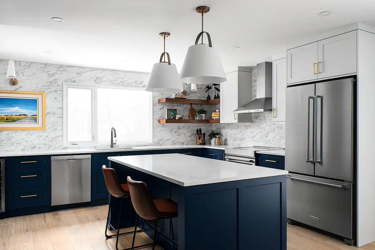 Beautiful kitchen with navy and white color scheme, modern appliances and wooden accents.