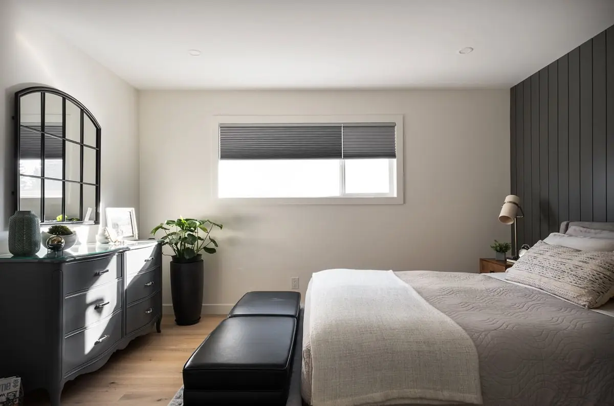 Bright bedroom with natural light and contemporary furnishings.