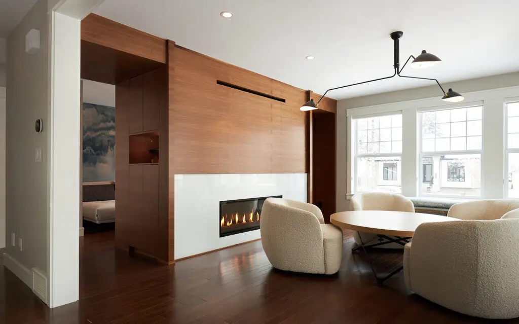 Bright living space with wood accents and cozy seating area.